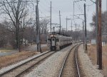 CSS 25 leads a westbound commuter train